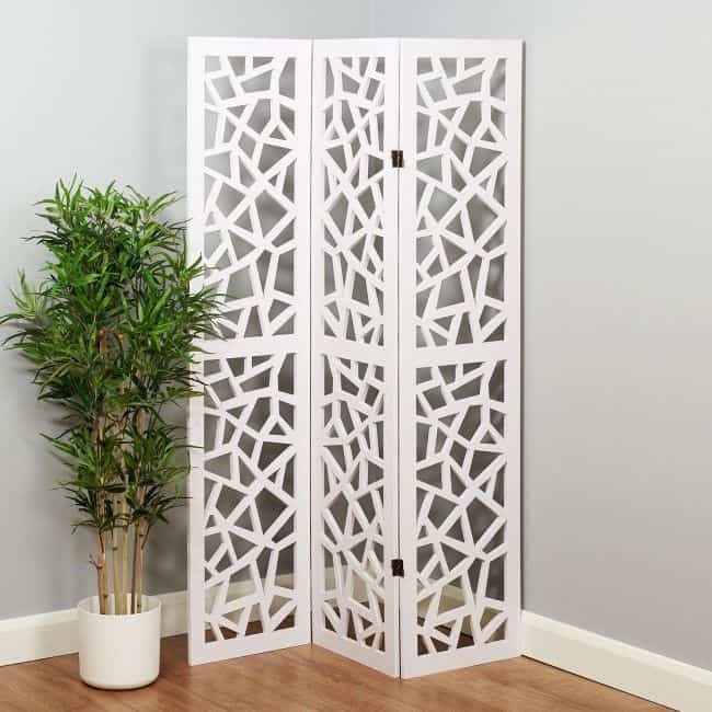 Versatile white decorative room divider with geometric cutout design, ideal for modern interior spaces and creating privacy or aesthetic appeal.
