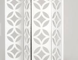 Elegant white decorative wall panel with intricate geometric floral patterns, perfect for enhancing modern interior aesthetics.